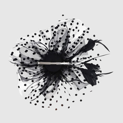 Chapeau de mariage fleur en voile et plumes sur serre-tête
