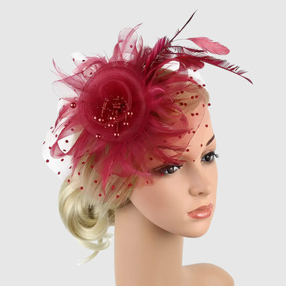 Chapeau de mariage fleur en voile et plumes sur serre-tête