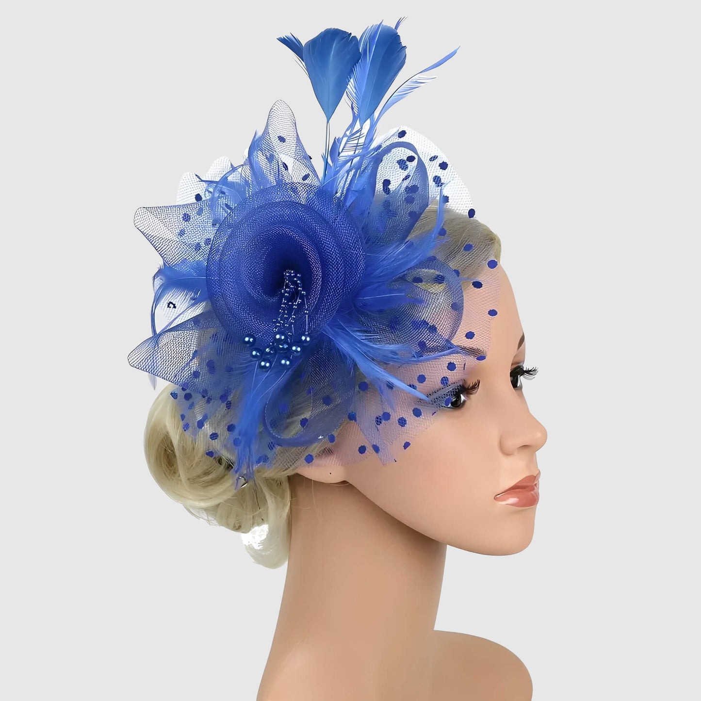 Chapeau de mariage fleur en voile et plumes sur serre-tête