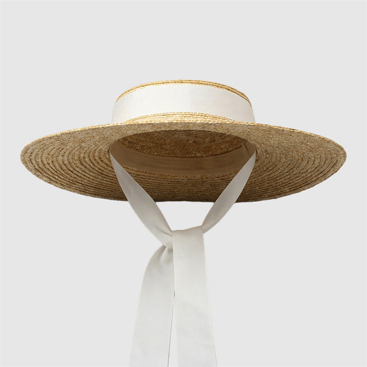 Chapeau de paille à bord plat pour femme au style estival élégant
